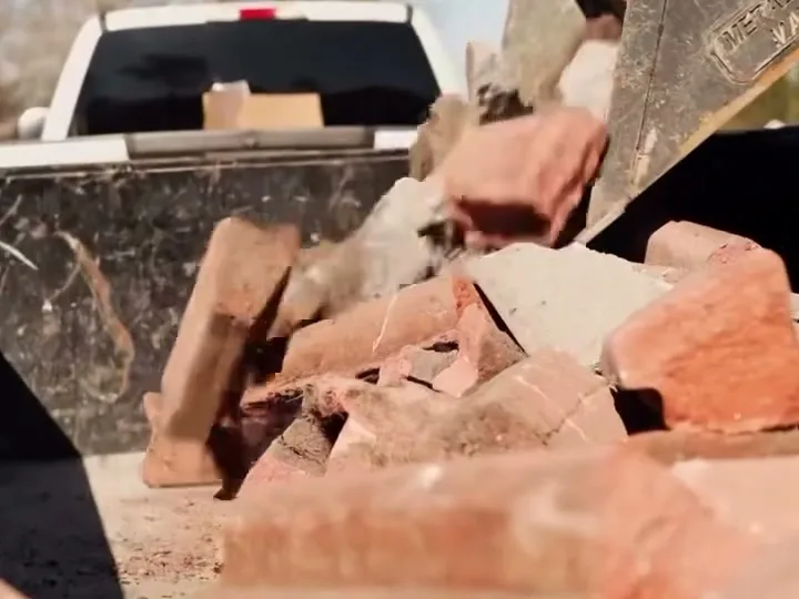 Broken brick and concrete debris loaded in the truck bed